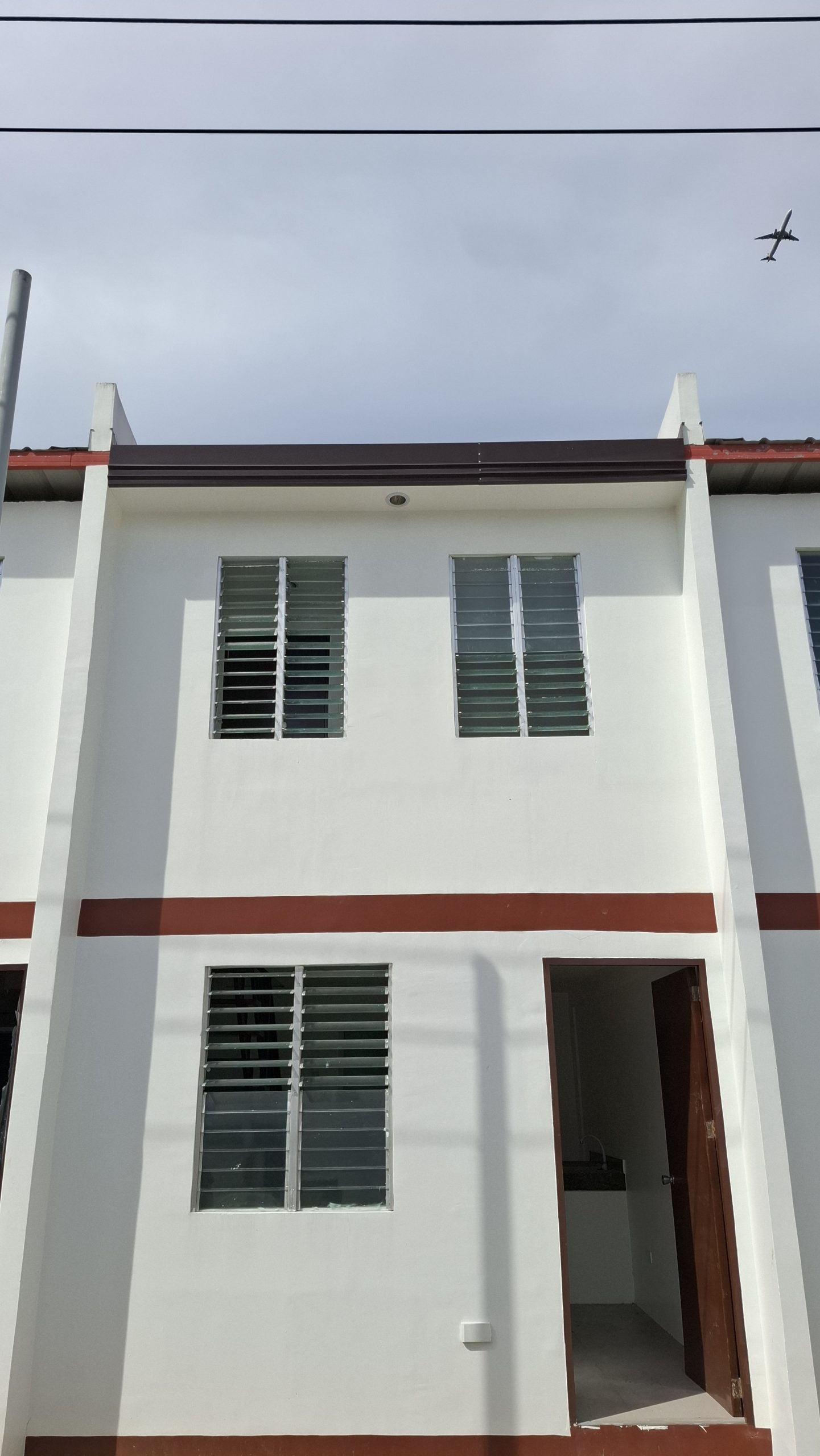 A row of two-storey socialized townhouses at Arira Homes Babag