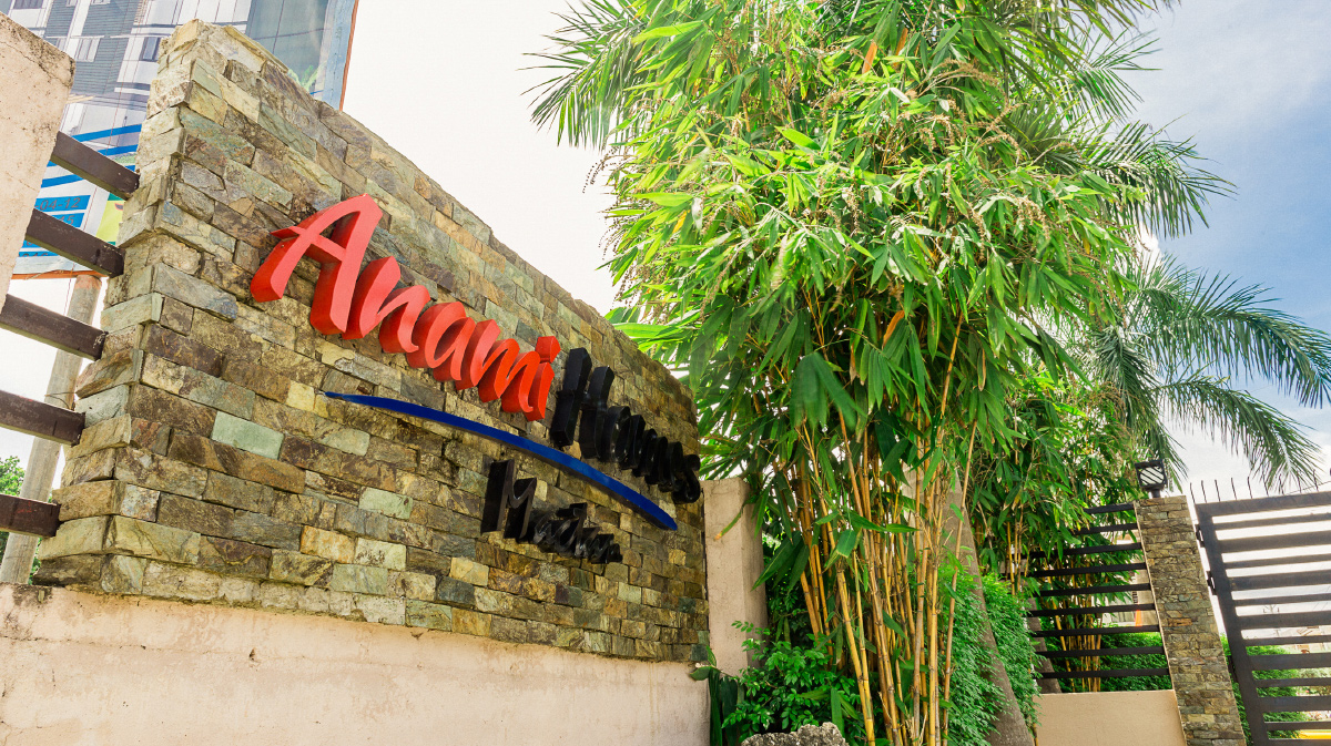The Anami Homes Mactan entrance monument, lettered in stone and planted with bamboo