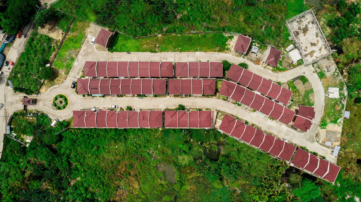 Aerial view of terraced rows of red-roofed houses on the slope at Anami Homes Mactan