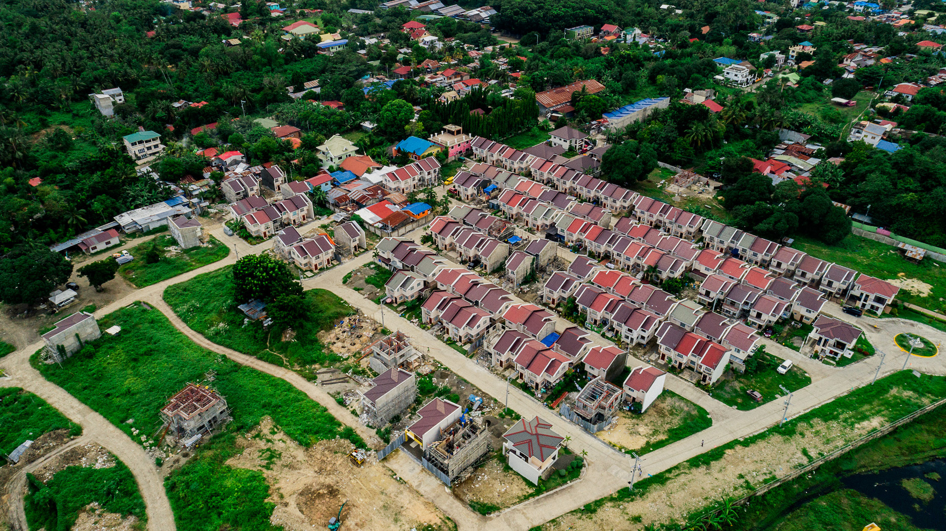 Aerial view across the red roofs of Anami Homes North