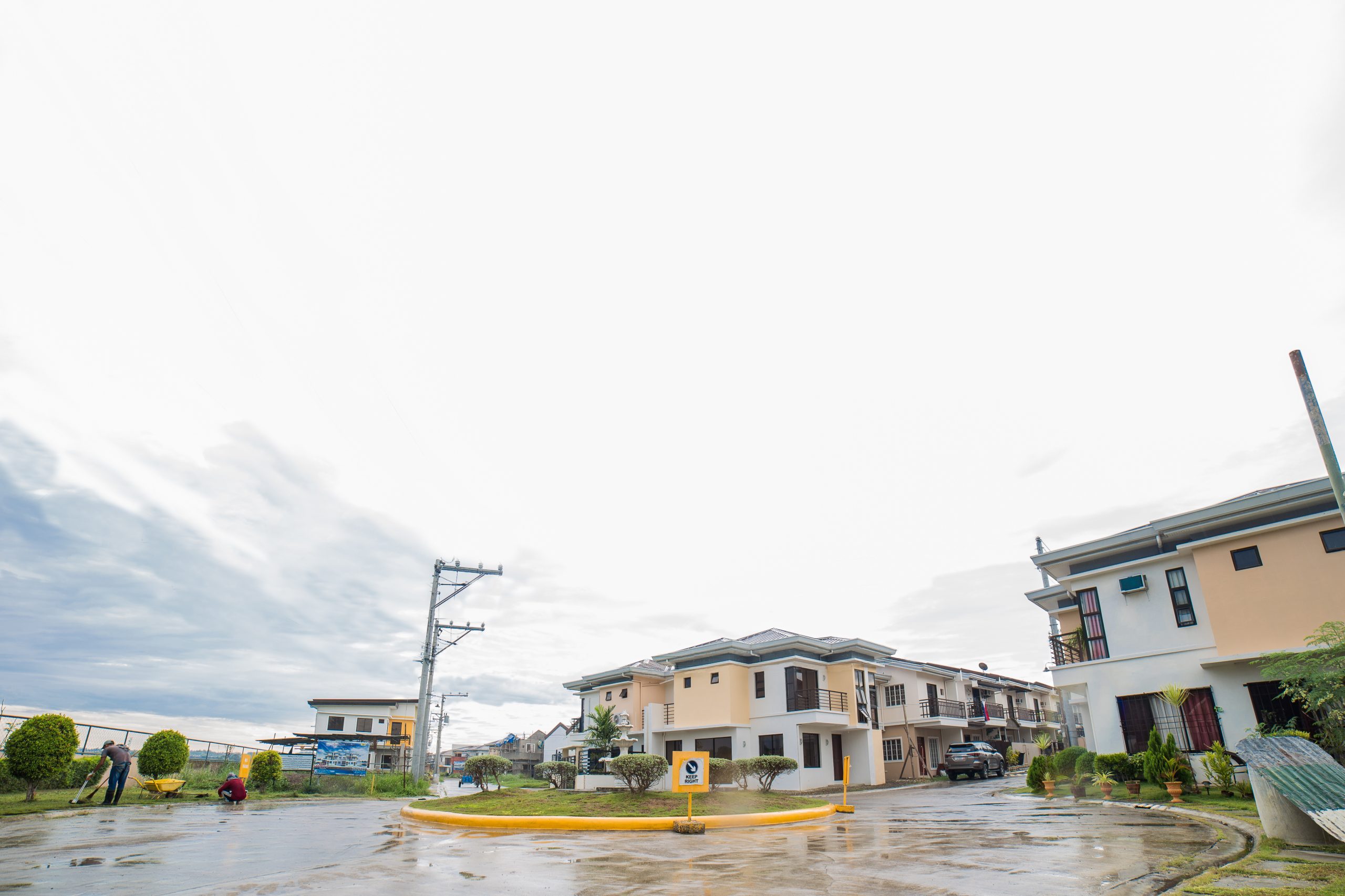 A residential street at Anami Homes North after rain