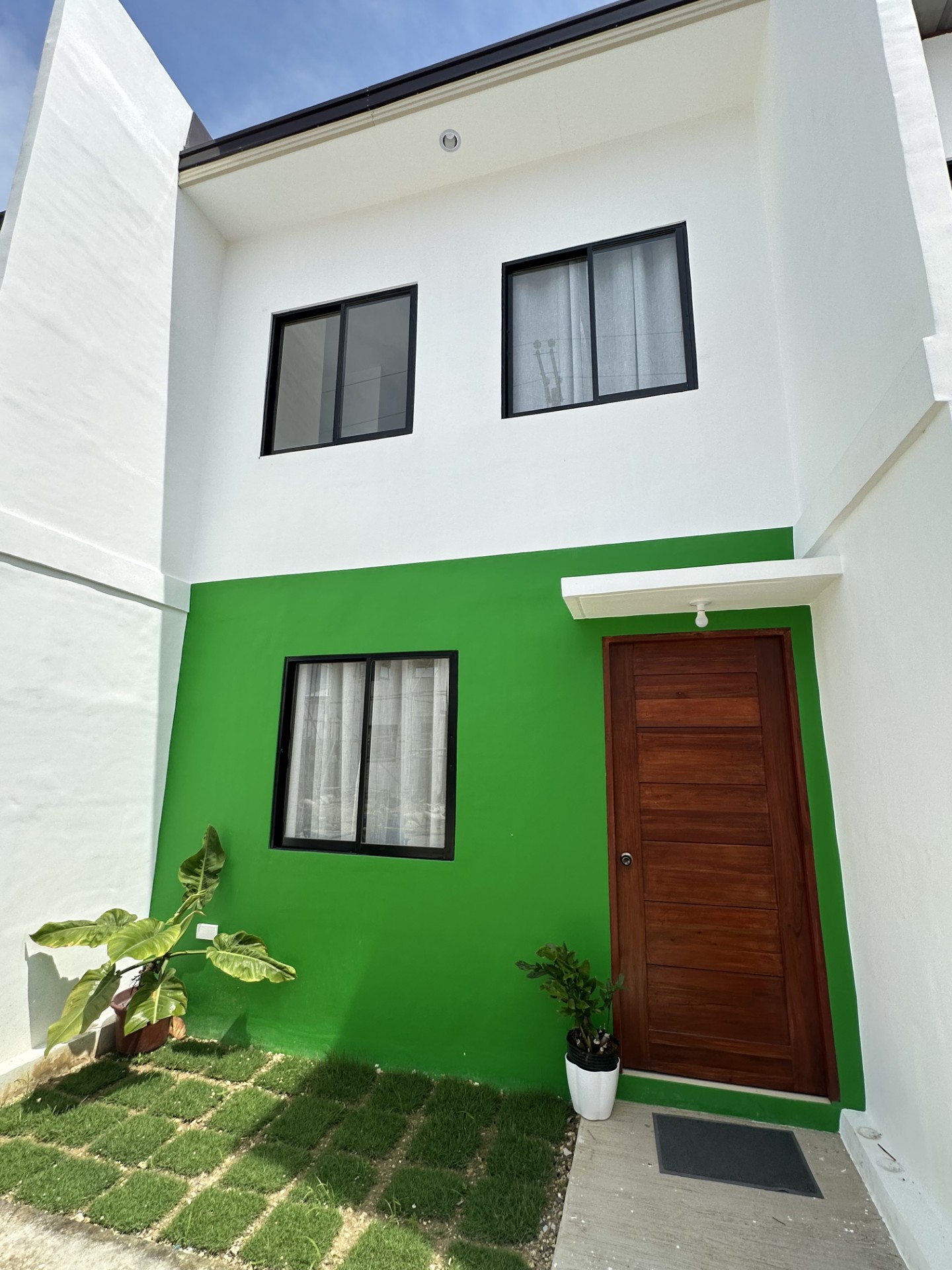 An economic unit at Arira Homes Babag in the Green Genie scheme, with a planted front yard